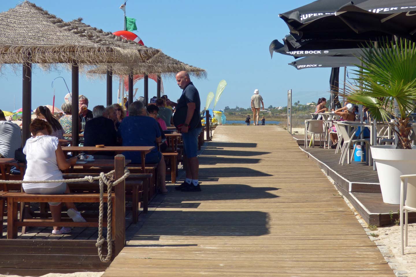 A photo of the boardwalk near Fuseta beach, running through the Borda d'Agua bar