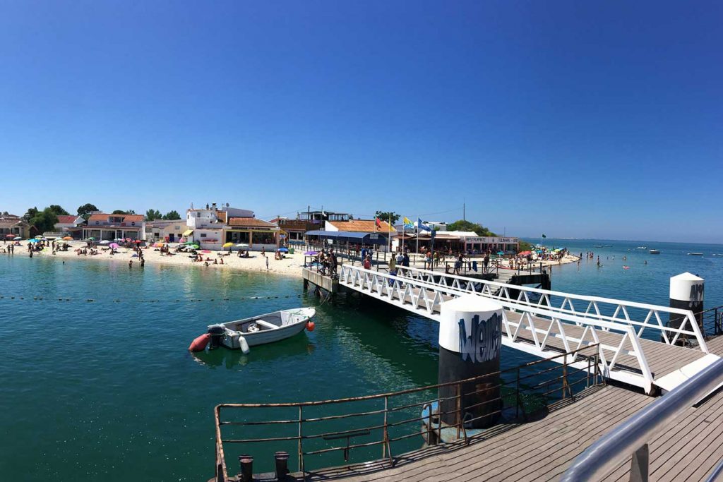 The Jetty on the Ilha da Armona with beach and restaurants in the background