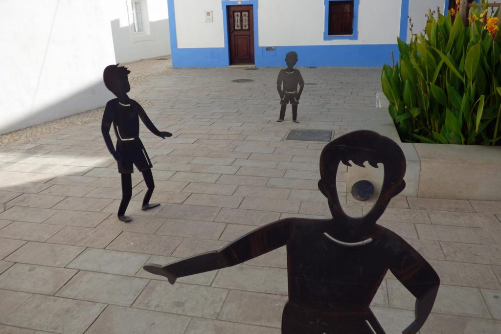 The Path of Legends: a photo of a statue of the Enchanted Moorish Boy playing with his friends