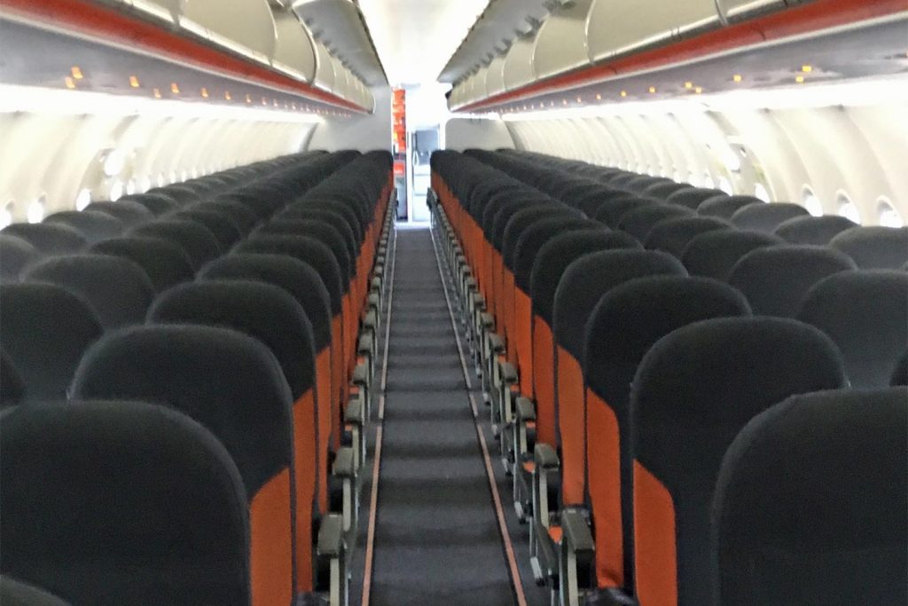 A Photo of the inside of an Easyjet plane with no passengers