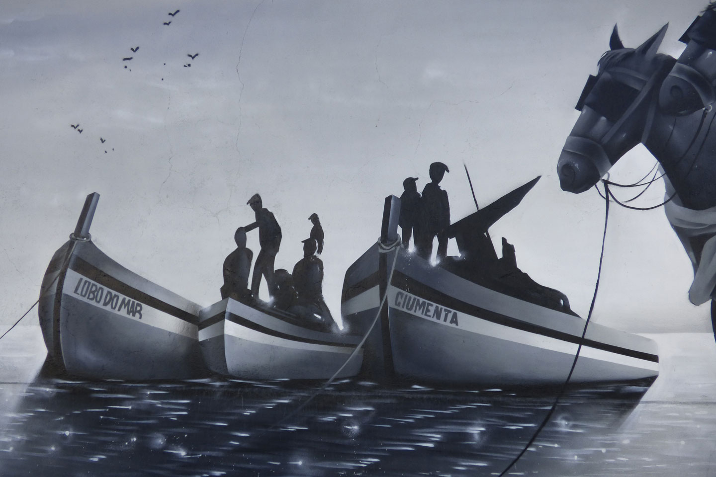 A photo of part of the Mural in Olhao, with fishing boats, fishermen and two horses