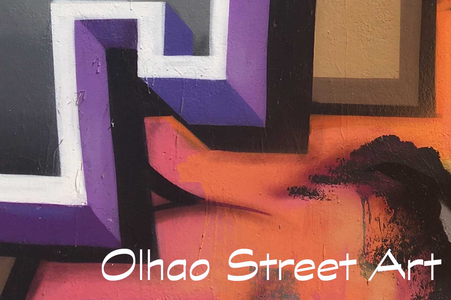 A Photo of Olhao Street Art - purple, white and red shapes shapes