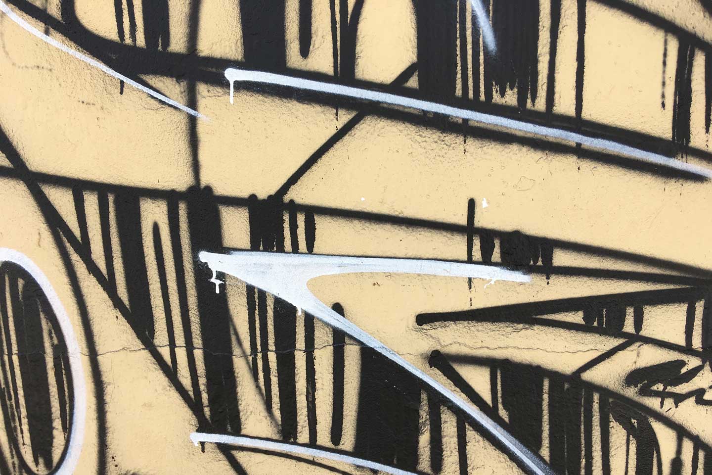 Olhao Street Art - black and white patterns on a beige background