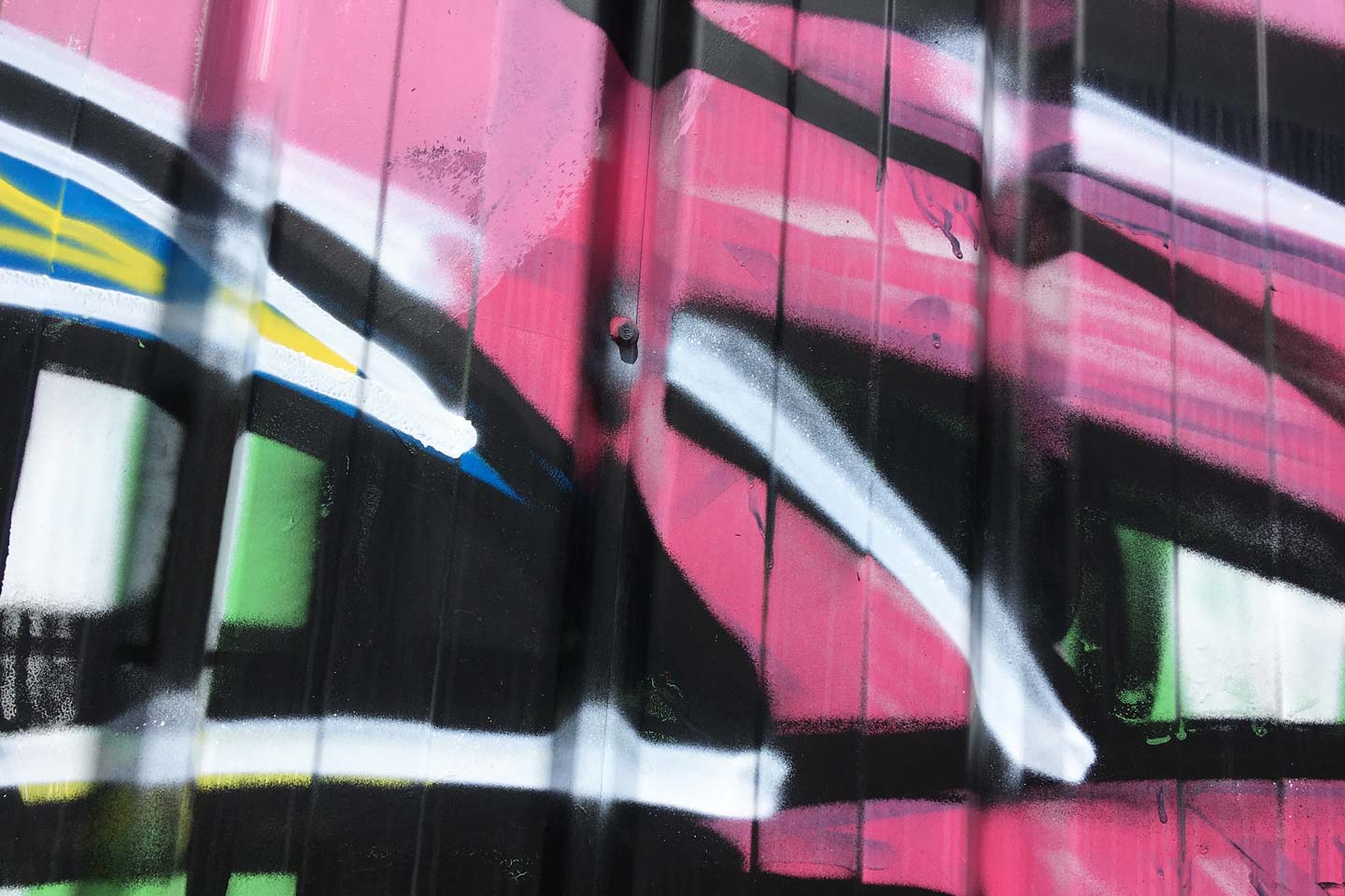 Olhao Street Art - pink, green, black and white shapes