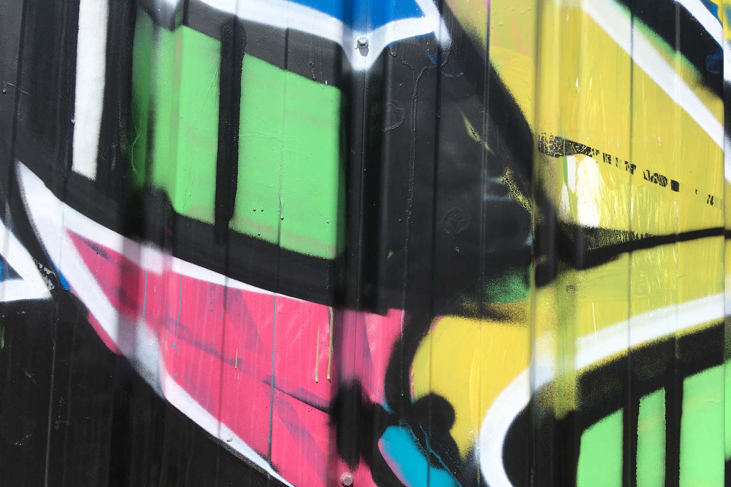 Olhao Street Art - pink, green, yellow and black shapes